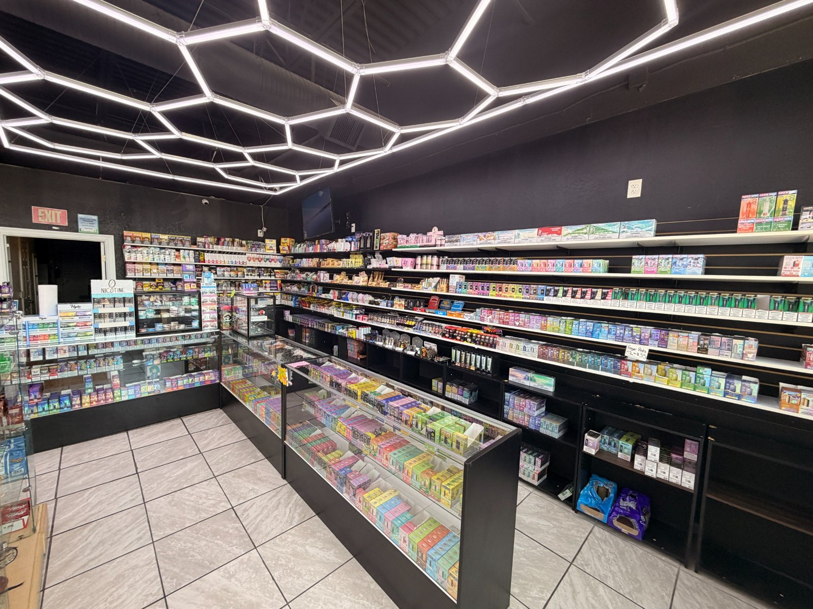 Vape shelves and display counters across the shop